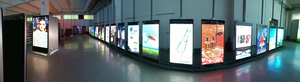 Large displays lining the walls of a building,